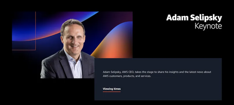 Homme souriant en costume devant un fond coloré. Texte: Adam Selipsky, Keynote. Informations sur les interventions. Ambiance professionnelle.